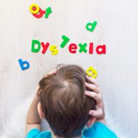 Child with dyslexia organizing letters