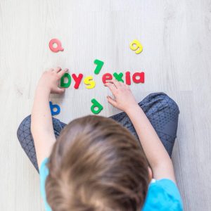 Child with dyslexia organizing letters