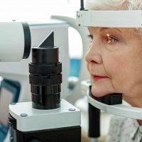 Elderly woman getting an eye exam